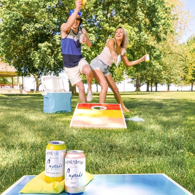 Cornhole in the park with Cupcake wine cans